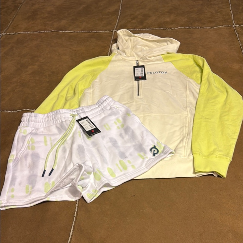 Peloton Cream and Yellow Hoodie with White and Green Shorts